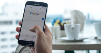 Mobile phone user doing a Google search.